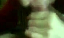 Dark-haired amateur in red sucks uncut cock suggestively.