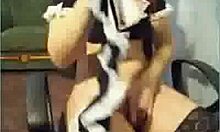 Stockings-clad redhead pleasures herself in an office chair