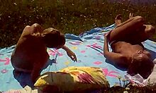 Look at these two slutty girlfriends sunbathing topless on the beach!