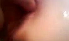 Detailed close-up view of a horny amateur wife getting her anal fingered intensely by her partner.