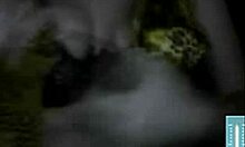 Russian mature amateur flashes big tits in dark striptease.