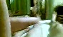 dark-haired hottie deepthroating cock on cam with handjob