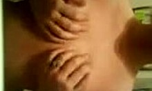 Amateur with impressive breasts trying to hide them on webcam