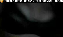 Russian mature amateur flashes big tits in dark striptease.