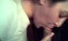 Brunette wife boldly blows and strokes cock like a professional in homemade scene.