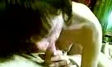 dark-haired hottie deepthroating cock on cam with handjob