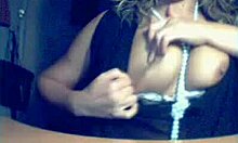 shades-wearing busty milf amateur reveals her figure in dress and panties