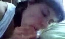 The dark-haired housewife in white attentively strokes and sucks, providing oral pleasure.