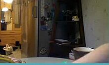 short-haired blonde milf strips on webcam, showing her tits.