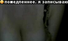 Russian mature amateur flashes big tits in dark striptease.