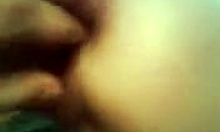 Detailed close-up view of a horny amateur wife getting her anal fingered intensely by her partner.