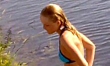 blond-haired amateur in cute bikini shows off outdoors