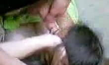 dark-haired amateur playfully sucking hot dick with long hair