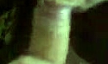 Dark-haired amateur in red sucks uncut cock suggestively.