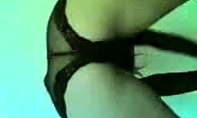 blonde milf in lingerie dances enticingly on cam.