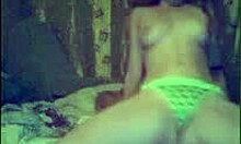 Look at this teen stripping her green panties and bra