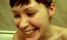 extremely happy chick brushing her teeth in the nude