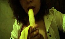 Dark-Haired Teen GF Sucks Banana Naughtily with Small Tits