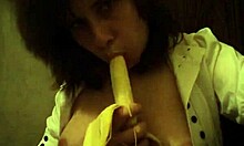Dark-Haired Teen GF Sucks Banana Naughtily with Small Tits