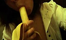 Dark-Haired Teen GF Sucks Banana Naughtily with Small Tits