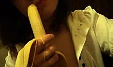 Dark-Haired Teen GF Sucks Banana Naughtily with Small Tits