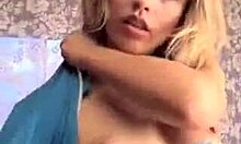 White Lingerie Blonde Playfully Poses on Camera for Intriguing View