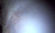 mature brunette plays with toys in stockings