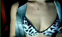 Amateur beauty strips in her bra on webcam.