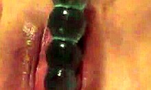 big pussy plays with rubber toys close-up