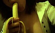 Dark-Haired Teen GF Sucks Banana Naughtily with Small Tits