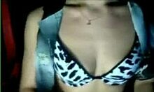 Amateur beauty strips in her bra on webcam.
