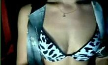 Amateur beauty strips in her bra on webcam.