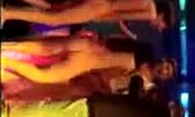 Brunette amateur strips naked and dances wildly on the night club stage