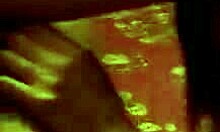 Dark-Haired Girl Struggles with Large Item on Camera