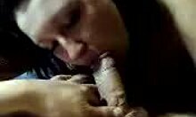 Brunette amateur deepthroats veiny cock in POV