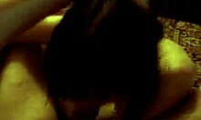 Dark-Haired Girl Struggles with Large Item on Camera