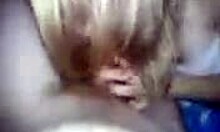 spunky blonde sucking a big fat cock in the dark bedroom