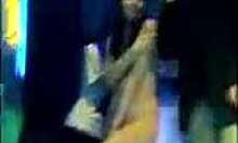 Brunette amateur strips naked and dances wildly on the night club stage