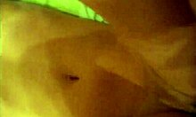 In this close-up view, an amateur engages in doggystyle fucking, with her shaved pussy getting gaped wide.