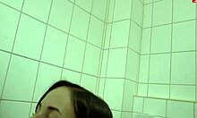 brunette slut kneels for pov blowjob in bathroom