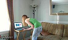 Elay, the cute busty redhead, strips naked at home for fun