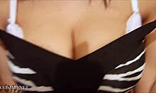 Wow! Check this big-titted brunette whore flaunting her oiled body now!