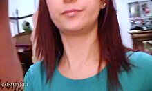 Pretty redheaded hottie admires her big natural boobs