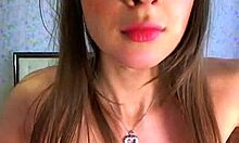 Naked brunette teasing her tits on cam?