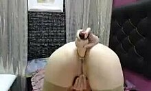 Luiza Sky inserts dildo into her tight butthole during solo act.