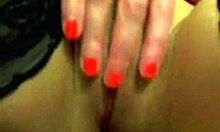 This brunette camwhore in lingerie is fingering herself hard to earn money