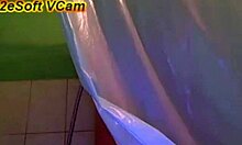 tattooed brunette teasing and taking a shower