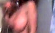 Buxom brunette girlfriend showers wet in homemade video.