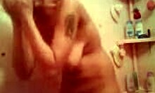 Amateur sweetie showers naked, her big tits and wet pussy on display in homemade porn.