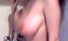 Buxom brunette girlfriend showers wet in homemade video.